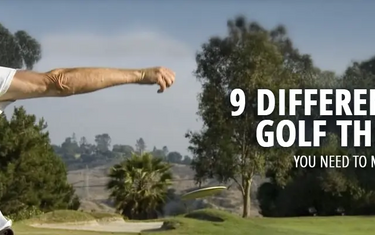 A disc golfer performing a backhand throw on the course.